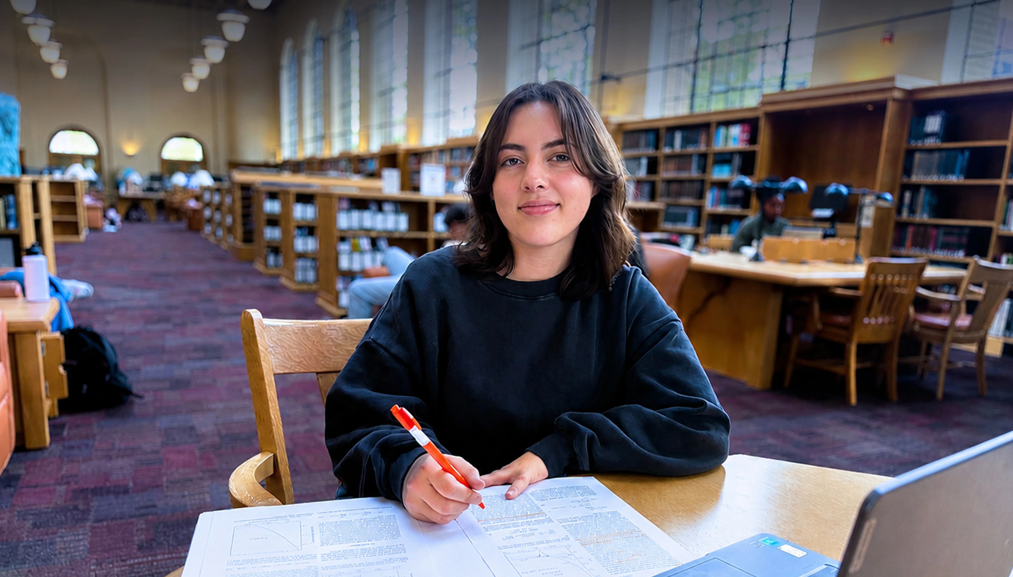 Polygence student studying in library